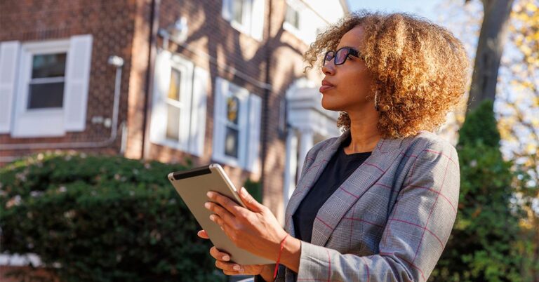 real estate appraiser with clipboard outside a home gettyimages 1440996545 1200w 628h