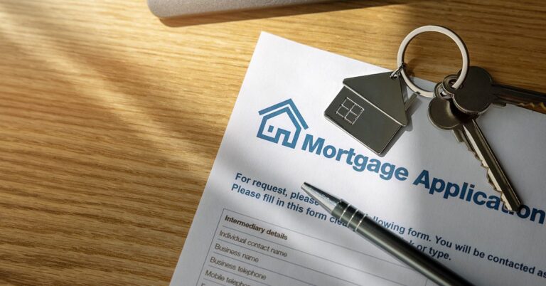 mortgage application form with key on house keychain and pen gettyimages 1411024421 1200w 628h