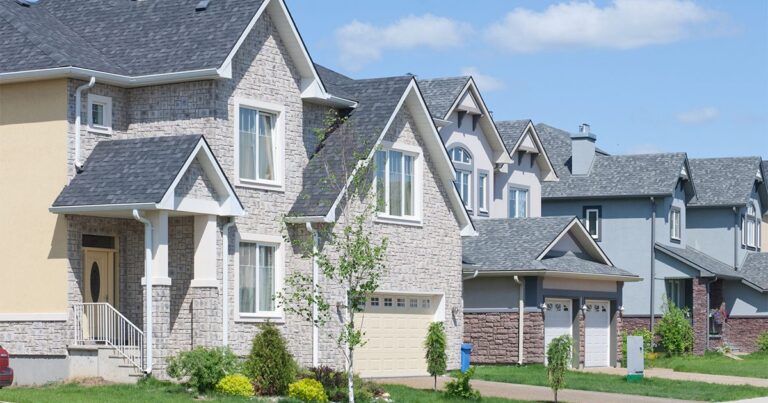 row of new homes in residential neighborhood GettyImages 165647175 1200w 628h